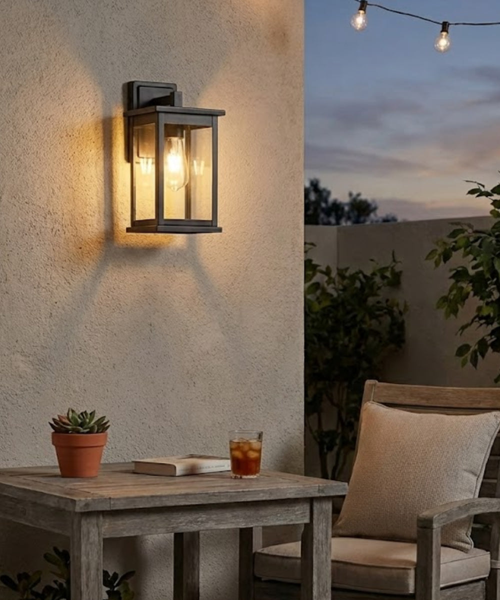 11"H Bowton II Outdoor Wall Light - Dusk to Dawn Matte Black Finish with Glass Shade by Millennium Lighting